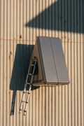 Jacintoport Hardshell Rooftop Tent closed profile on galvanized metal background